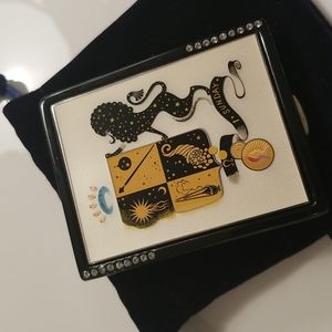 Estee Lauder Collectible compact for solid perfumes and pressed powder.